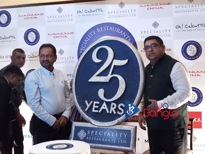 Sambaran Banerjee and Anjan Chatterjee with 25th anniversary logo