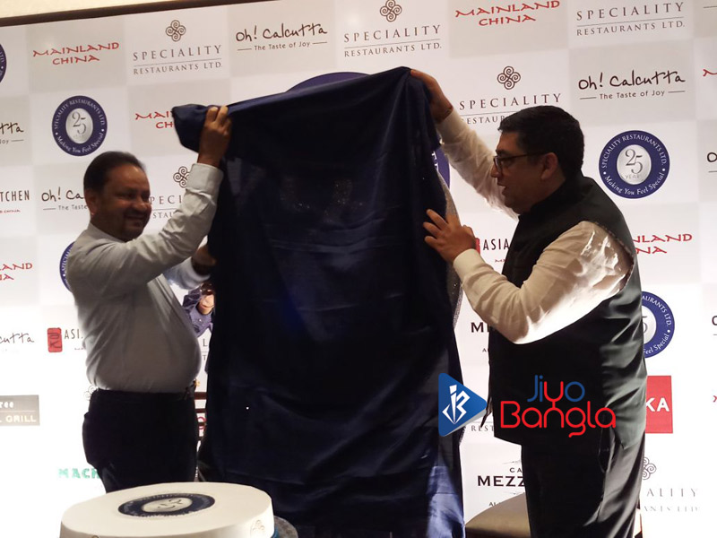 Sambaran Banerjee and Anjan Chatterjee unveiling their 25th anniversary logo