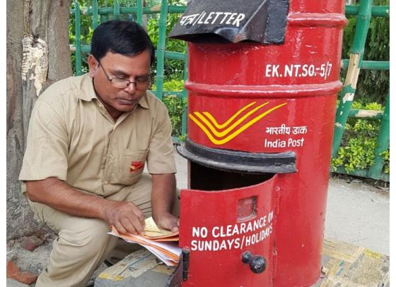 বার কোড লাগানো হচ্ছে ডাকবাক্সে