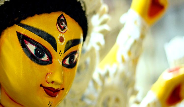 Who enrooted Durga Puja?
